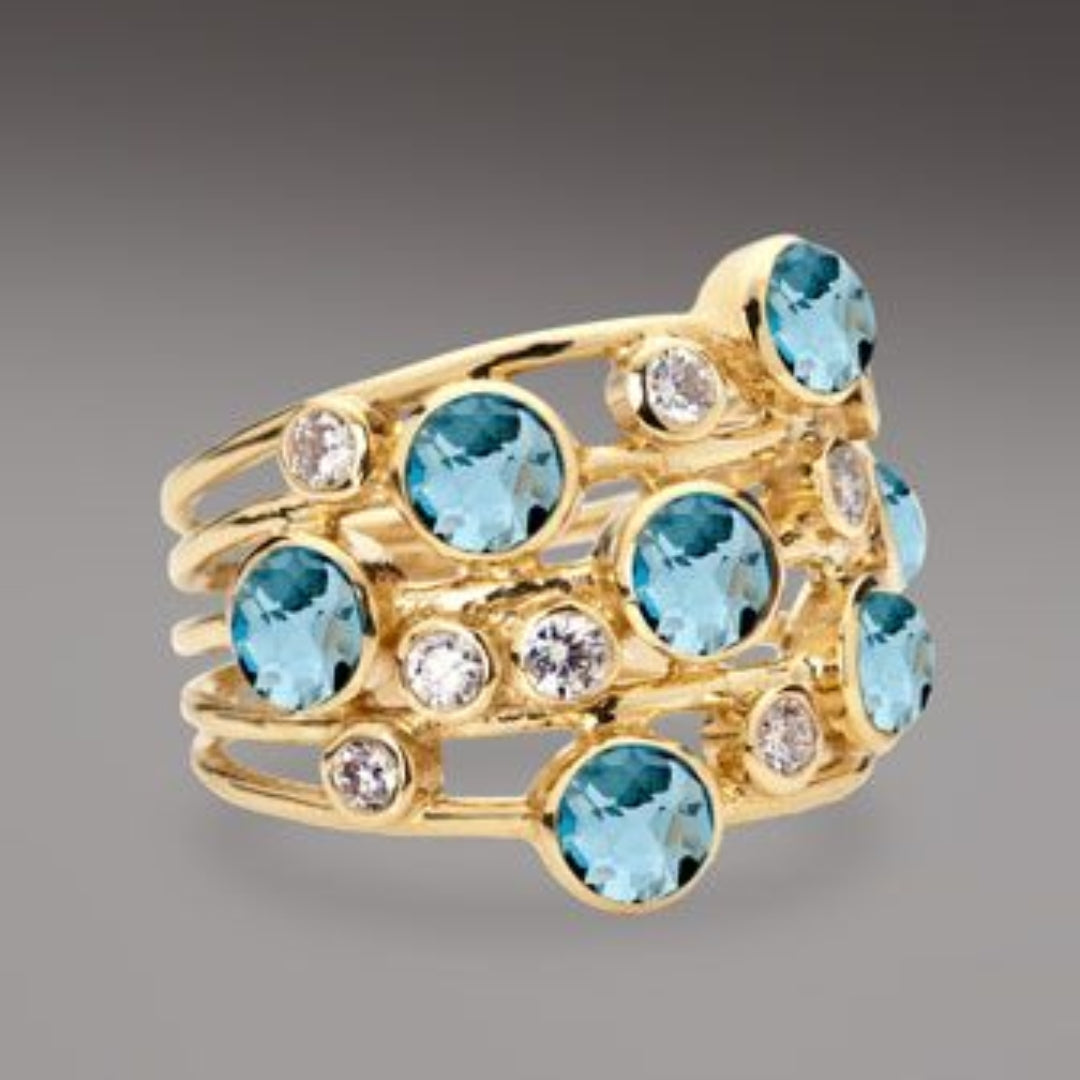 Vintage Goldring mit vielen blauen und weißen Zirkoniasteinen