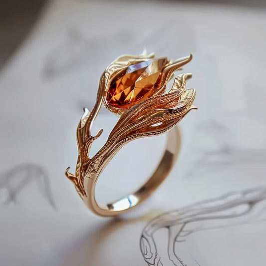Goldring mit orangefarbenem Kristall