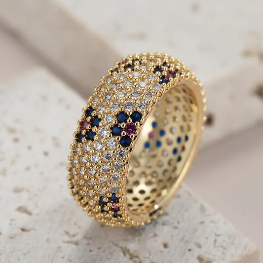 Goldring gelocht mit blauem und lila Zirkonia